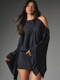 Front view of black halter mini dress with draped cape sleeves, fitted skirt and exposed shoulders