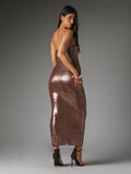 Rear three-quarter view of brown snake-pattern strapless maxi dress showing straight back neckline and ankle-length pencil shape