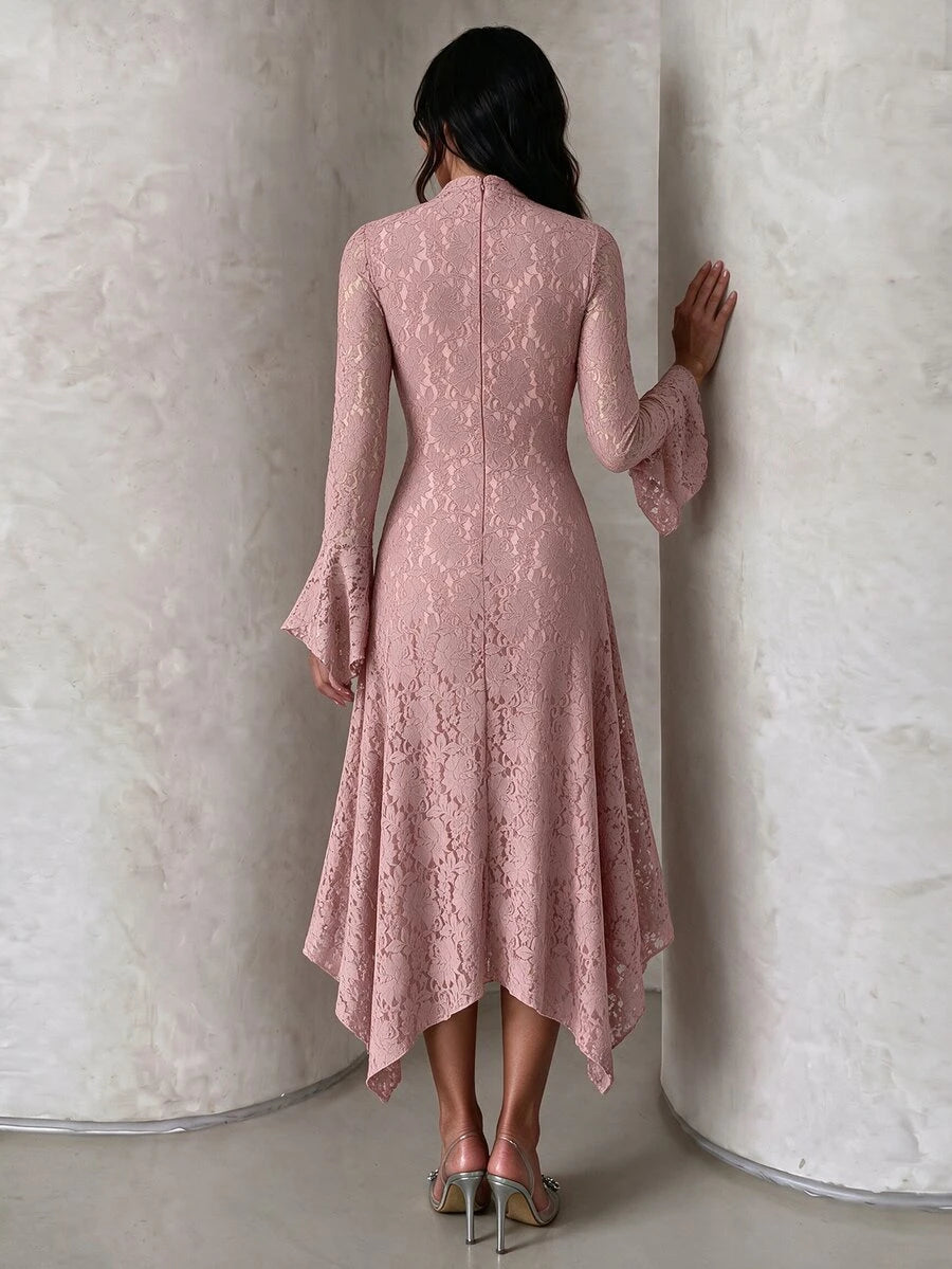 Rear view of the dusty-rose lace dress showing its fitted waist, back closure and uneven hem.