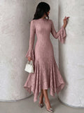 Three-quarter view showing the dusty-rose lace dress, stand collar, flared cuffs and high-low hem.