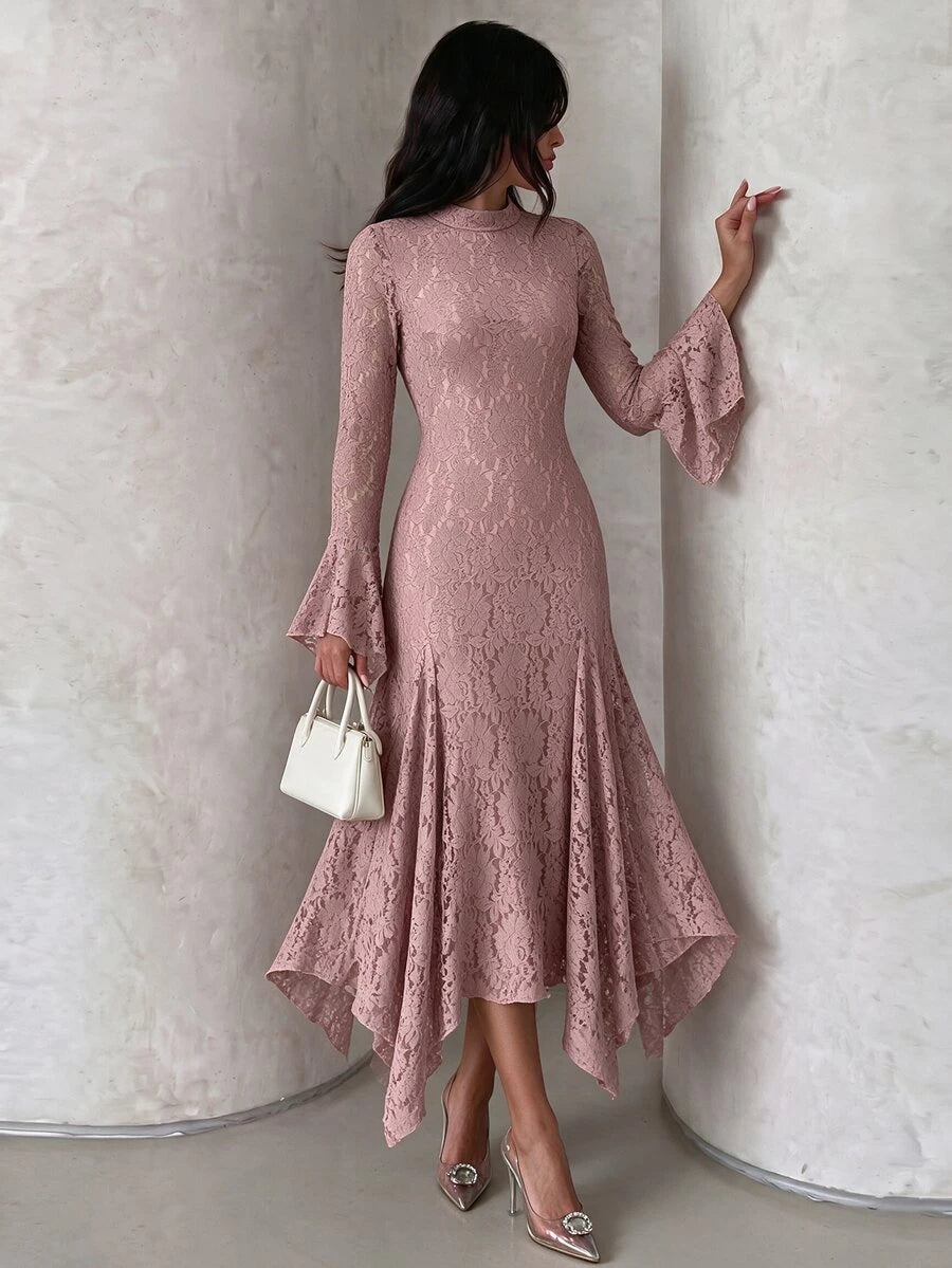 Three-quarter view showing the dusty-rose lace dress, stand collar, flared cuffs and high-low hem.