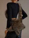 Rear view of oversized brown fuzzy star-shaped shoulder bag showing the plush body and strap