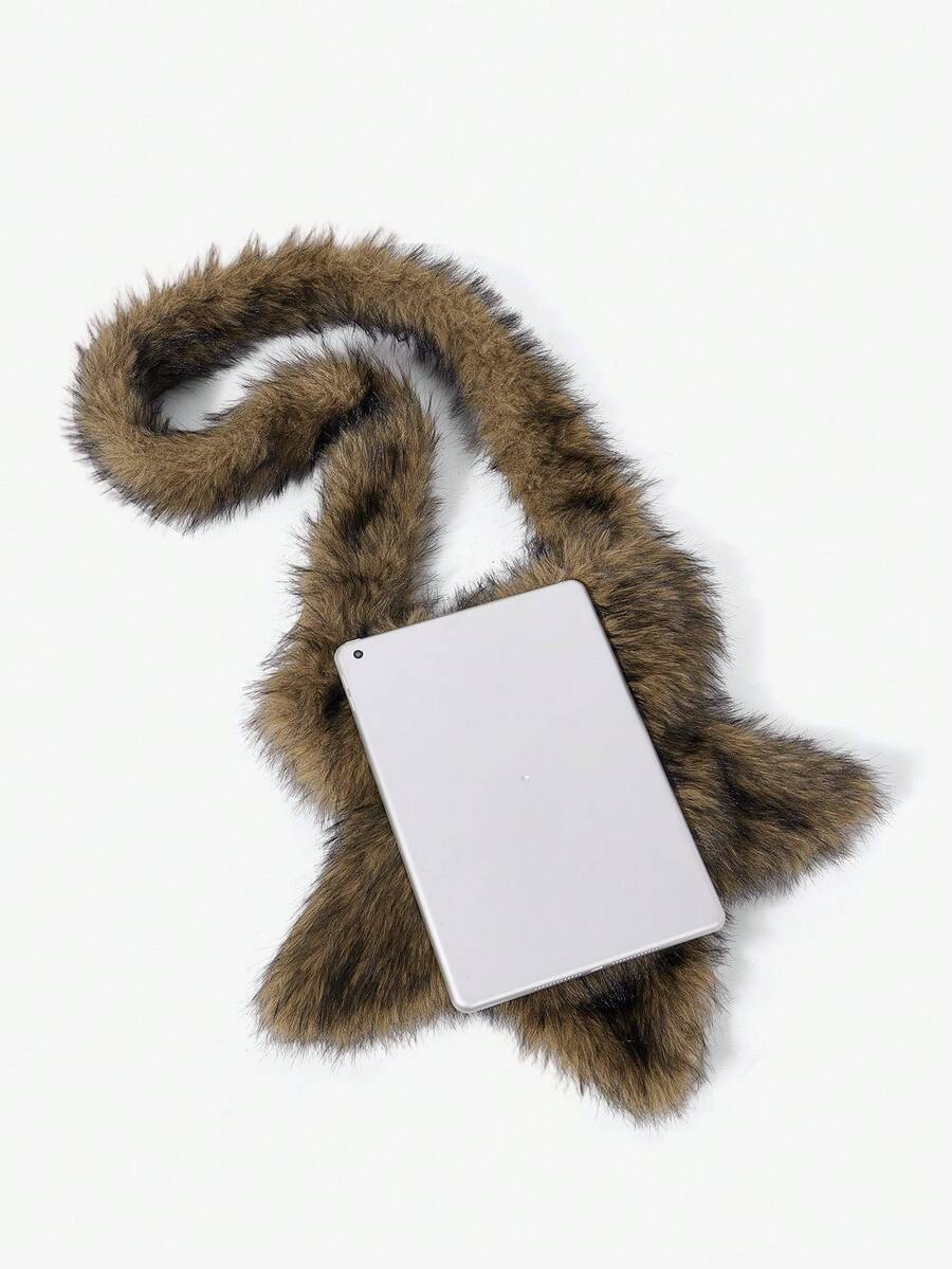 Close view of brown faux-fur star bag and strap with a small metal eyelet detail