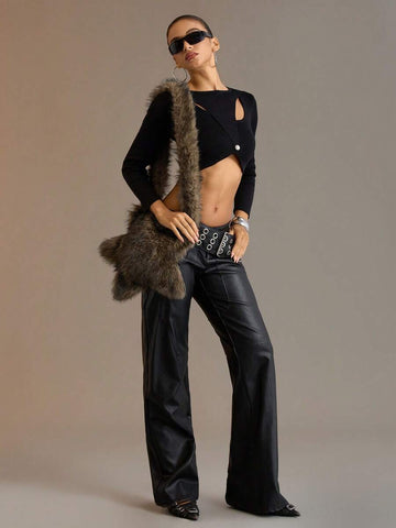 Model carrying brown faux-fur star shoulder bag with long plush strap in a streetwear outfit