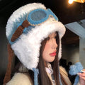 Side view of model wearing blue and white plush-lined aviator trapper hat with braided ties