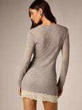 Back view of grey knit two-piece outfit showing lace-trim mini skirt