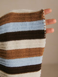 Close-up of the dress’s rib-knit fabric and horizontal cream, brown, dark-brown and pale-blue stripes