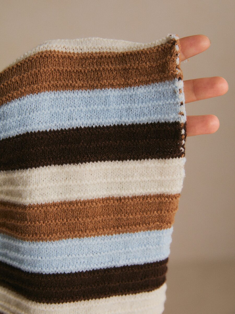 Close-up of the dress’s rib-knit fabric and horizontal cream, brown, dark-brown and pale-blue stripes