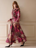 Full-length side view of the flowing multicolor animal-print dress with high waist and slit hem.