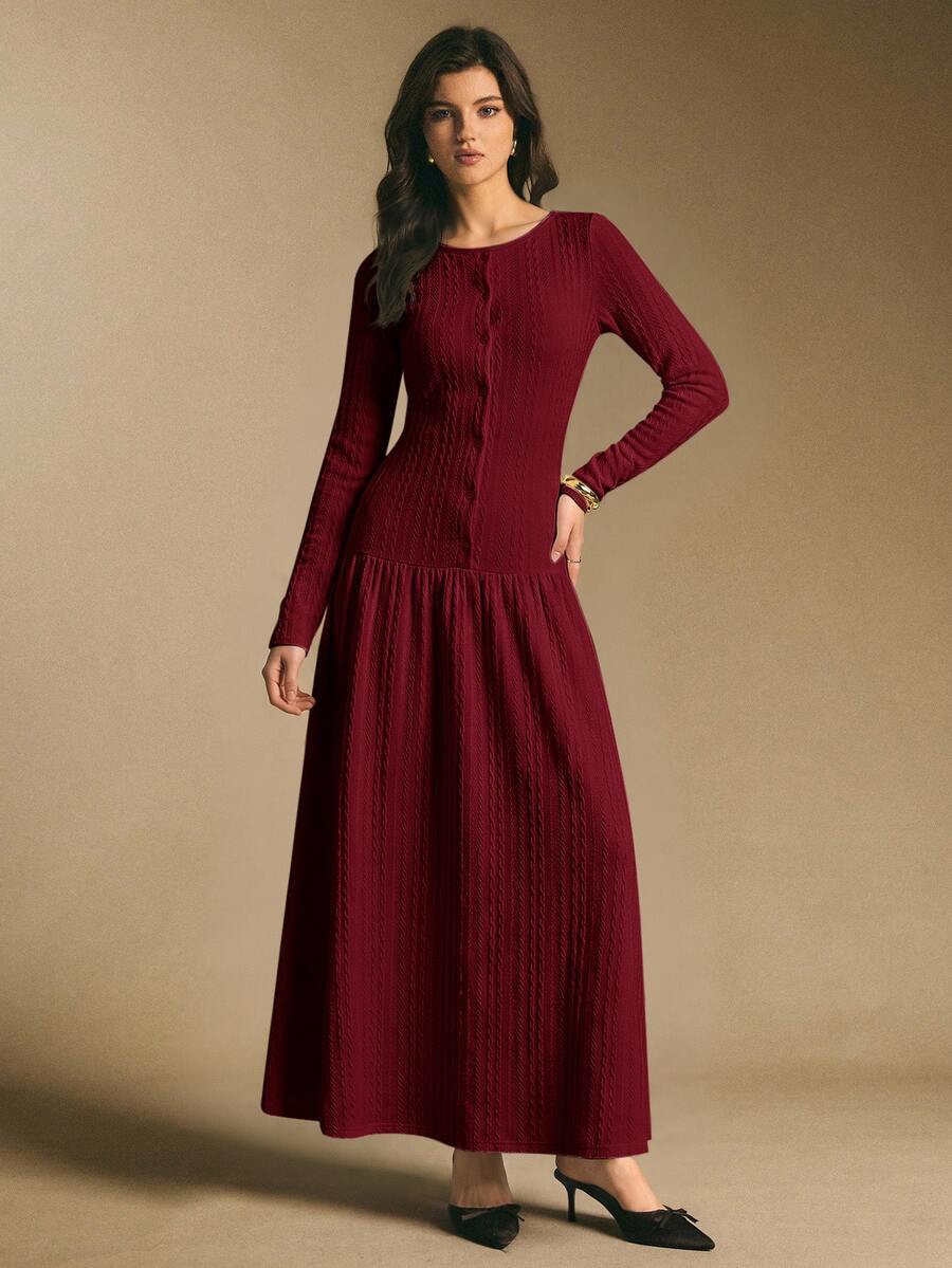 Front view of a burgundy textured long-sleeve maxi dress with round neckline, front buttons, fitted waist, and flared skirt