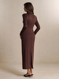 Back view of the chocolate brown long-sleeve fitted dress showing collar, contoured seams, straight ankle-length skirt, and back slit