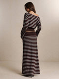 Back view of brown striped two-piece outfit showing wide neckline and full-length skirt