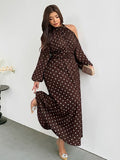 Angled front view of brown polka-dot plus size halter maxi dress