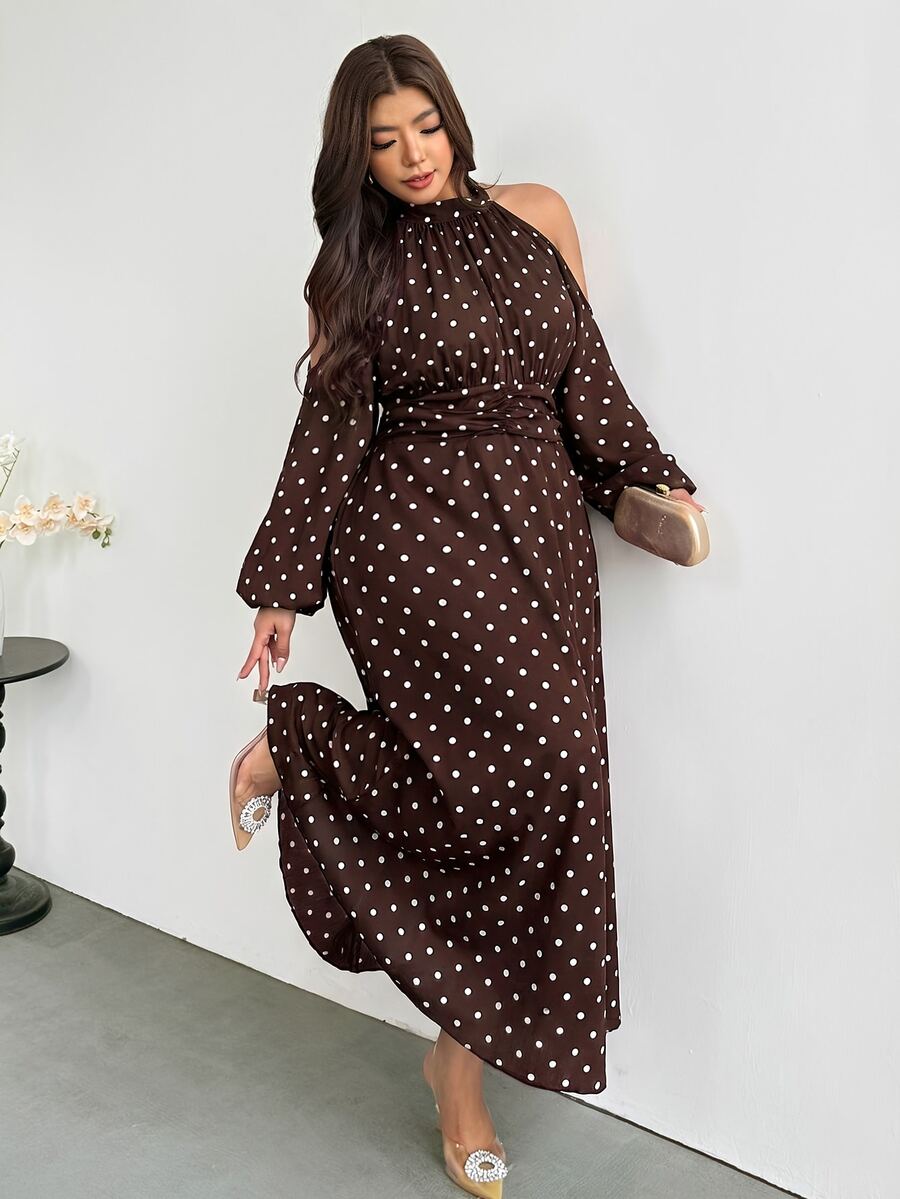 Angled front view of brown polka-dot plus size halter maxi dress