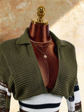 Close view of olive wide collar knit crop top with open front and striped sleeves