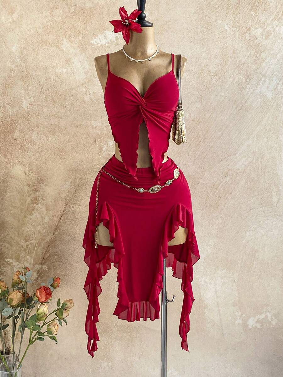 Elevate your summer wardrobe with this effortless two-piece set. The twist camisole features a flattering draped neckline that adds dimension and movement, while the asymmetric hem skirt creates a modern, fashion-forward silhouette.
