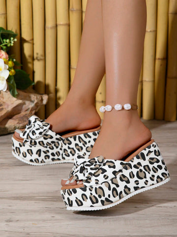Experience style and comfort with our 2024 Trendy White Leopard Bow Platform Wedge Sandals for Women. These sandals feature a trendy white leopard print, a stylish bow, and a platform wedge for added height. Elevate any outfit with these fashionable and chic sandals.