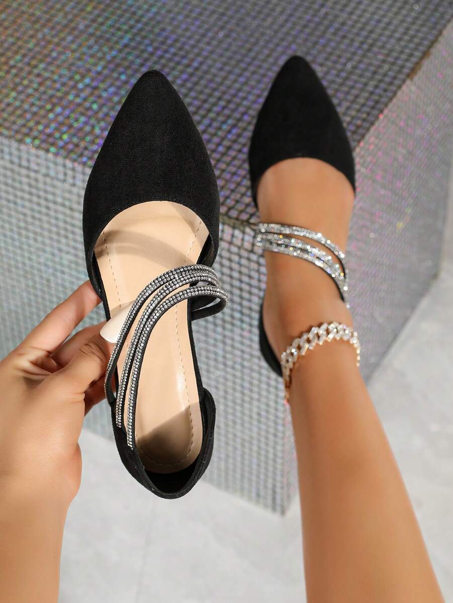 Step into sophistication with these stunning rhinestone-embellished flat shoes that blend elegance with everyday wearability. Crafted from luxurious black suede leather, they feature a chic pointed toe and eye-catching rhinestone detailing that catches the light beautifully. The non-slip sole keeps you steady whether you're heading to the office, a special event, or a casual outing. Versatile enough to pair with virtually any outfit, these beauties work as party shoes, work flats, or weekend sandals. Perfec
