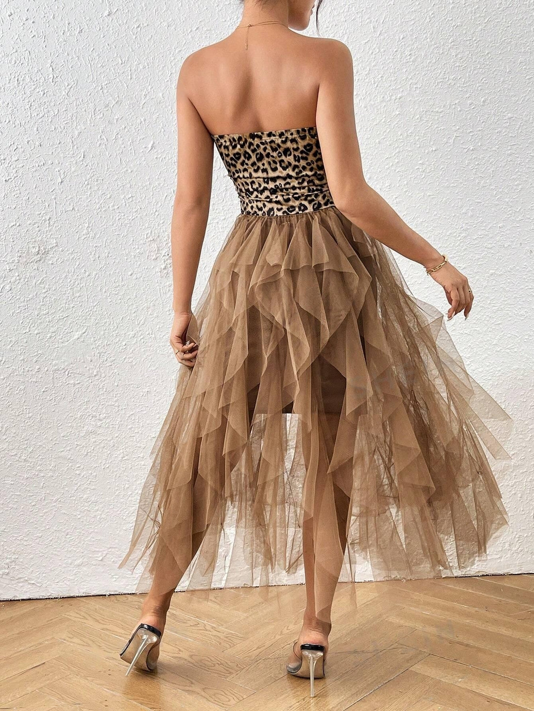 Get back to school in style with our Leopard Print Off-Shoulder Mesh Patchwork Dress! This trendy dress combines the fierce print of leopard with the playful touch of mesh patchwork, making it the perfect statement piece for any school event. Embrace your individuality and stand out from the crowd with this must-have dress.