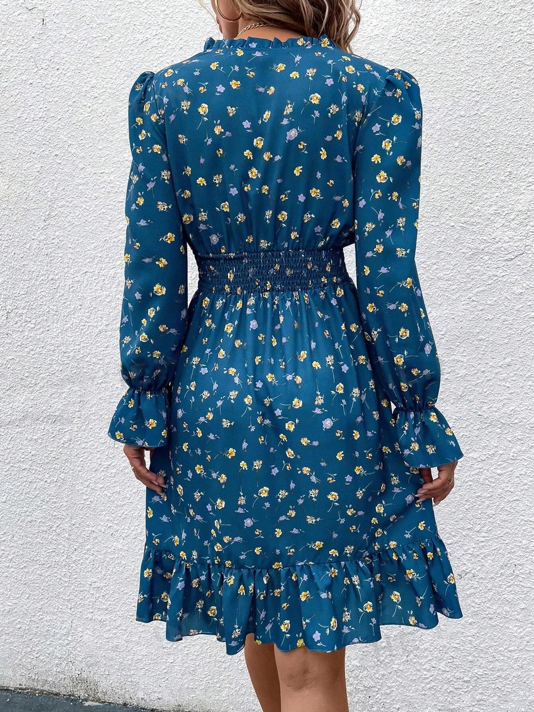 Indulge in the whimsical beauty of our Floral Fantasy: Ditsy Floral Print Notch Neck Shirred Waist Dress. The delicate floral print and charming notch neck add a touch of feminine elegance, while the shirred waist provides a flattering silhouette. Perfect for any occasion, this dress is a must-have for your wardrobe.