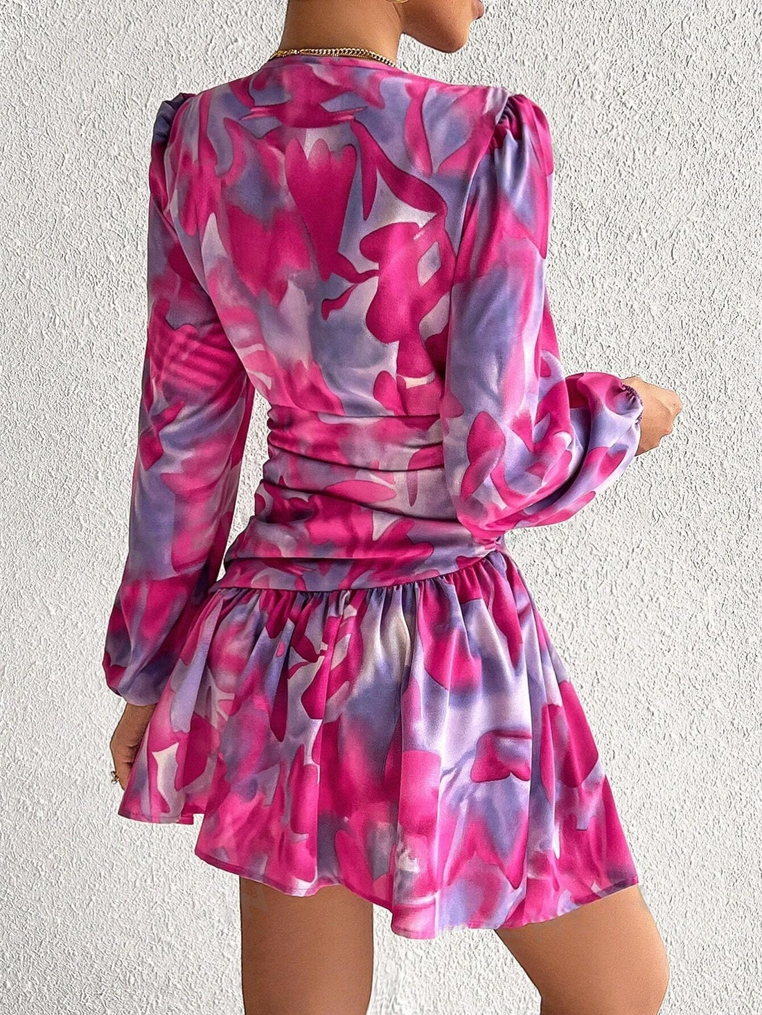 Experience the dreamy combination of floral designs and tie-dye in our Lantern Sleeve Dress. Made with a relaxed fit and elegant lantern sleeves, this dress provides a comfortable and stylish look for any occasion. Stand out from the crowd with our unique and trendy Floral Dreams dress.