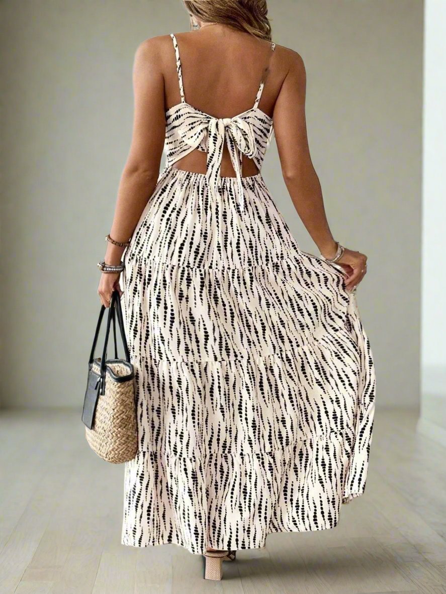 Experience effortless beauty and comfort with our Plus Size Women's Random Printed Cami Dress. Made with high-quality fabrics, this dress features a flattering fit and an intricate random print design. Perfect for any occasion, this dress will make you feel fabulous and confident.