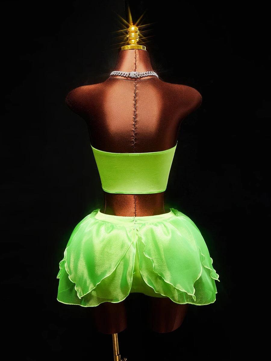 Front view of neon green fairy costume with structured crop top layered leaf skirt and printed wings