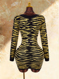 Back product view of black and yellow tiger stripe long sleeve knit mini dress