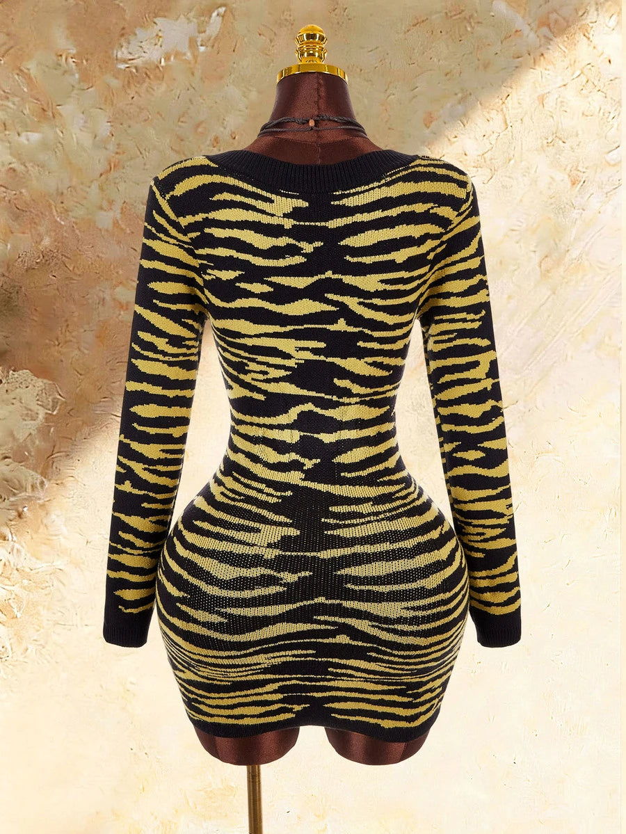 Back product view of black and yellow tiger stripe long sleeve knit mini dress