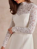 Close-up of floral lace stand collar, long sleeves, and curved ivory bodice seams