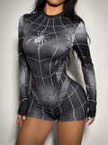 Close-up front view of black grey spider graphic and web print romper