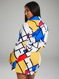 Back three-quarter view of geometric print long sleeve mini dress with fitted waist