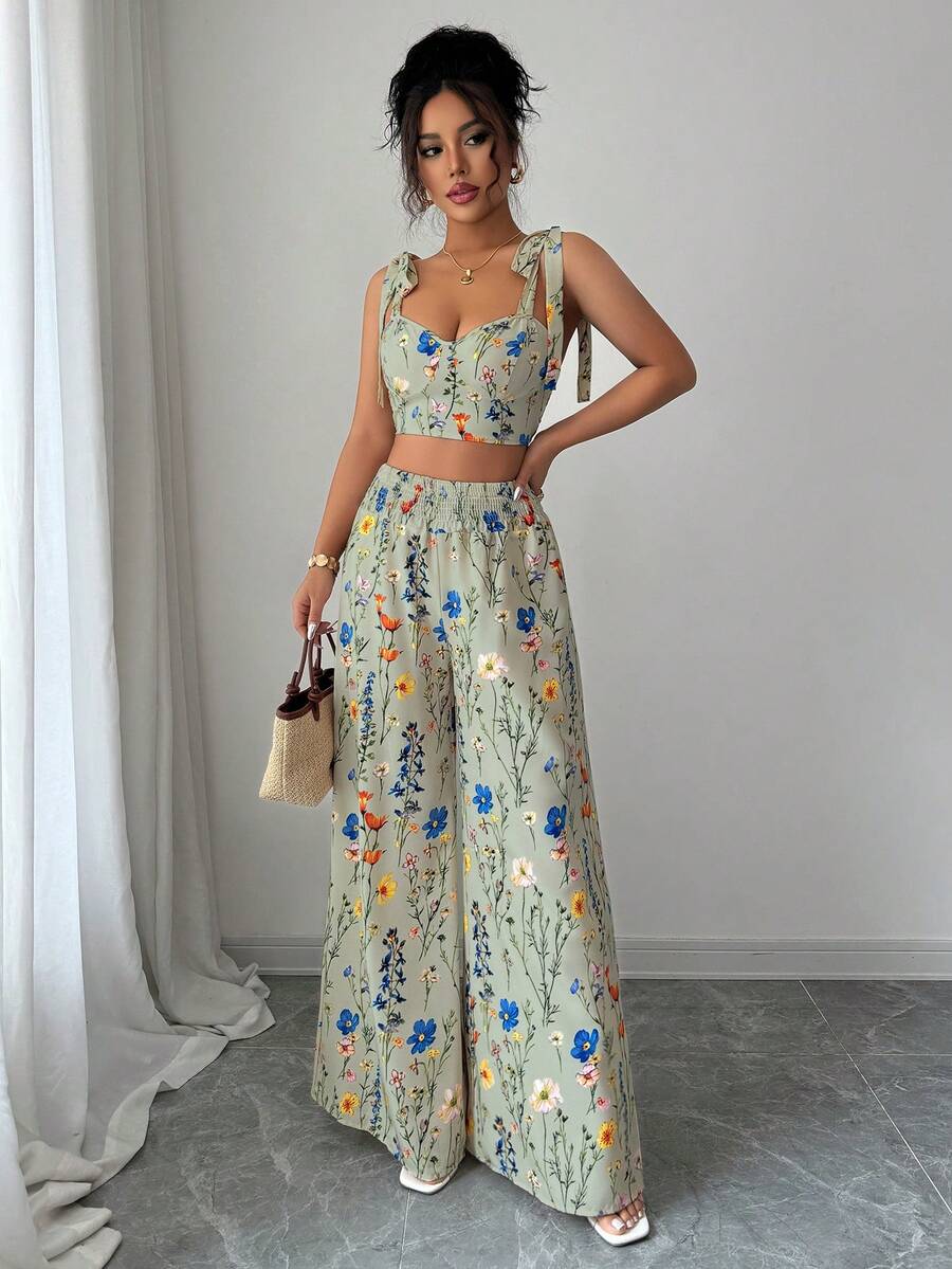 Elevate your wardrobe with this chic 2-piece set featuring a spaghetti strap top with a striking back cutout design paired with high-waist wide-leg straight pants. The cutout detail adds modern flair while the structured silhouette flatters your figure. Perfect for casual outings, brunch dates, or evening events, this versatile set transitions seamlessly from day to night.