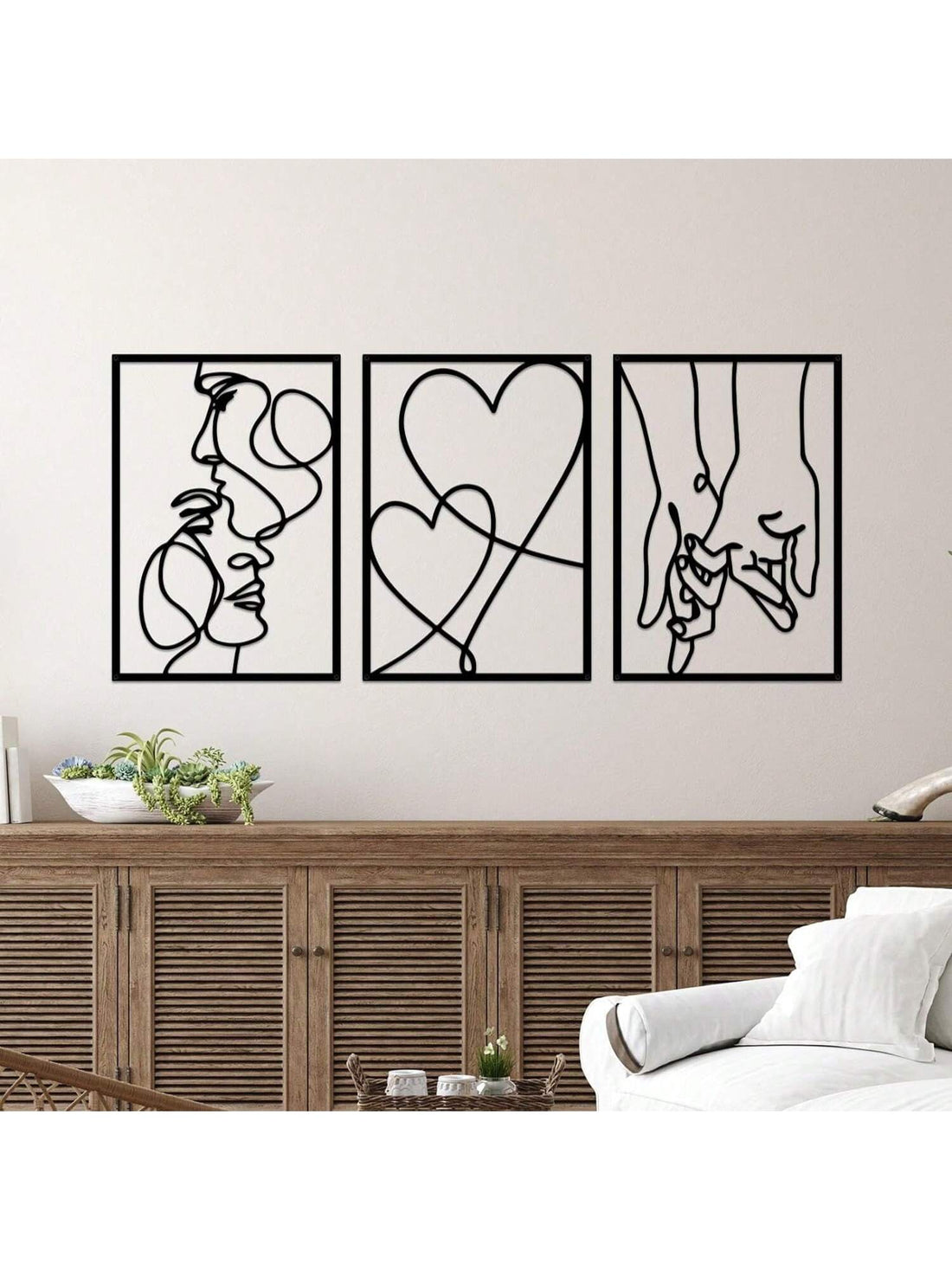 Add a touch of romance to your space with this 3-piece metal line painting set. Featuring sleek, intertwined designs, it’s made for couples who want to celebrate their bond every day. Ideal for Valentine's Day or simply brightening up your home, these lightweight metal artworks bring playful elegance and love to your walls. Easy to hang and designed to complement any décor, they’re the perfect reminder that love is always in the air.