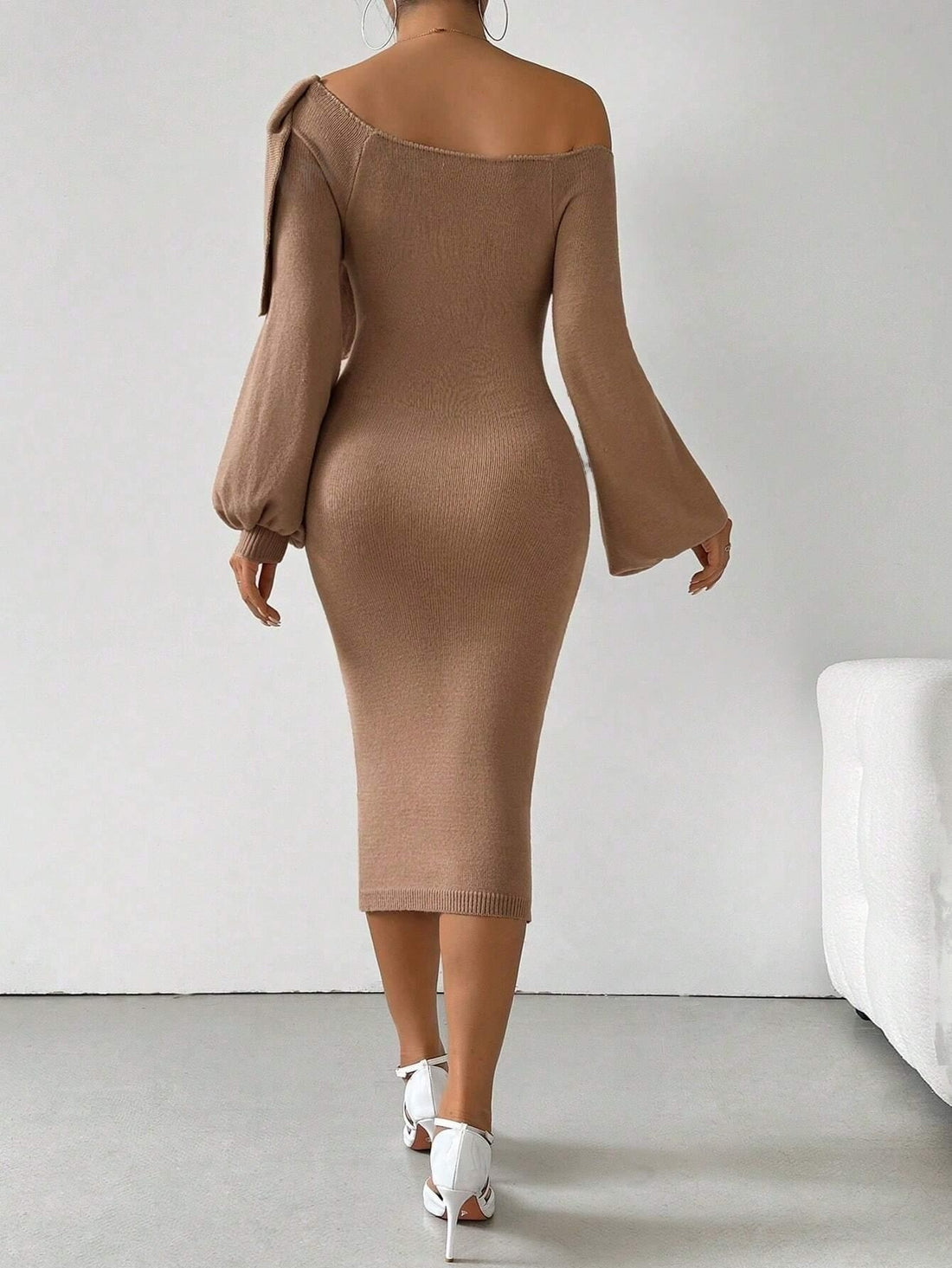 Upgrade your wardrobe with our Chic and Cozy Women's Asymmetrical Neck Bow Sweater Dress. This stylish dress features an asymmetrical neck and a bow detail, creating a chic and elegant look. Made with high-quality material, it's both cozy and comfortable to wear. Elevate your style with this must-have dress.