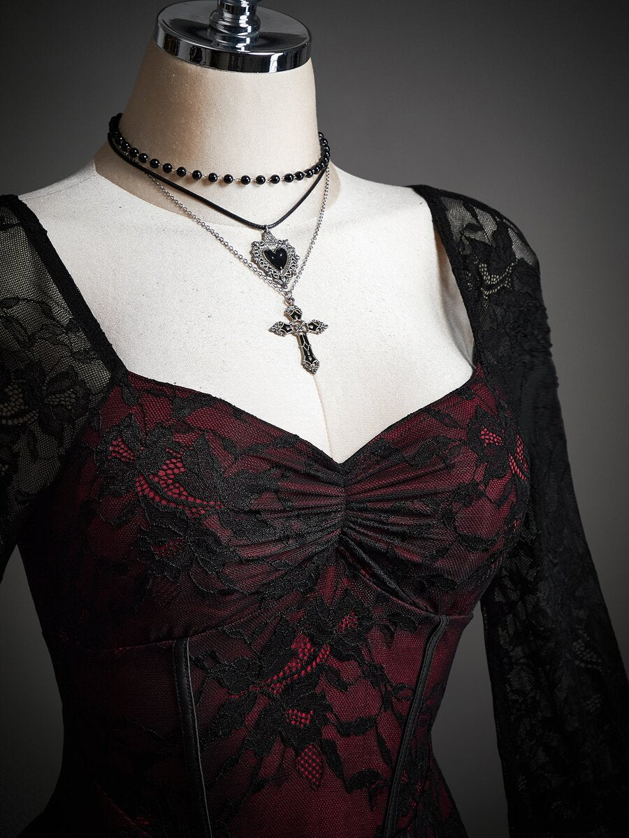 Front view of burgundy black lace dress with ruched sweetheart bodice and sheer sleeves