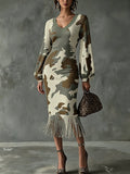 Front full-length view of camouflage ribbed knit bodycon midi dress with V-neck and fringe hem