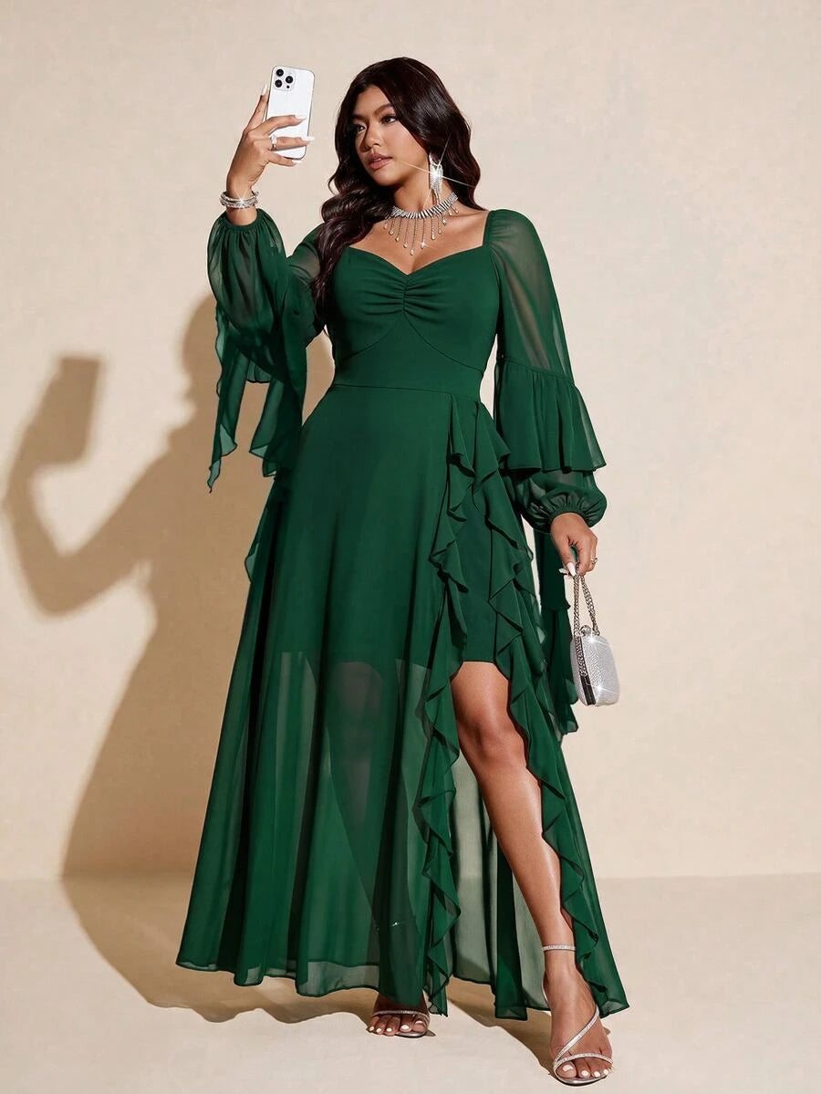 Front view of dark green plus-size evening gown with draped ruffle, slit and sheer bishop sleeves