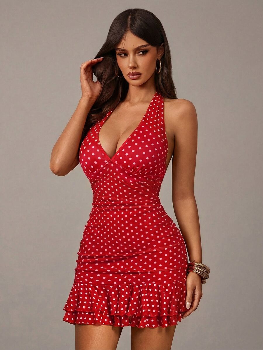 Close front view of red and white polka dot dress highlighting the halter V neckline and fitted bodice