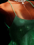 Close-up of green spaghetti strap and sparkly fairy dress bodice