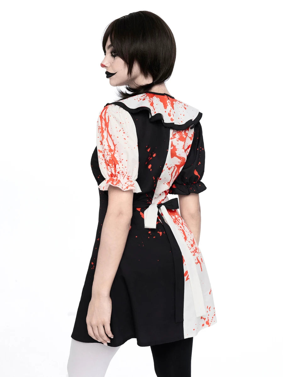 Rear three quarter view of black white clown dress with red splatter and back bow