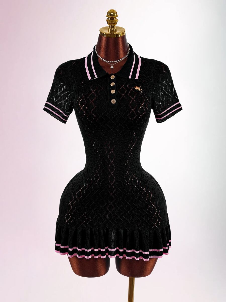 Mannequin front view of black knit polo mini dress with short sleeves, pink-striped trim, gold buttons, and pleated hem