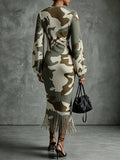 Back view of camouflage ribbed knit bodycon midi dress with long bishop sleeves and fringe hem
