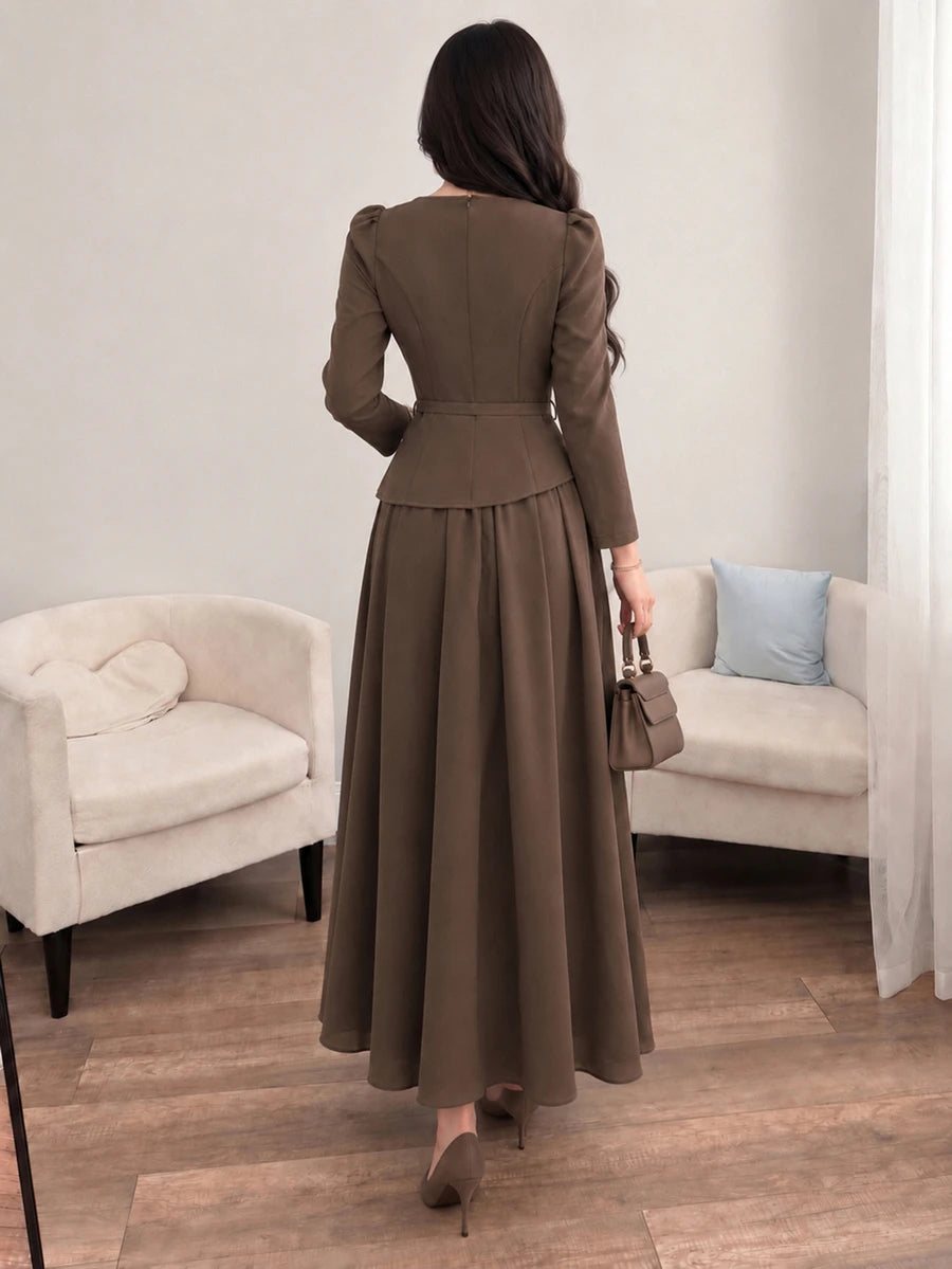 Front view of brown square-neck A-line midi dress with long puff sleeves and slim buckle belt