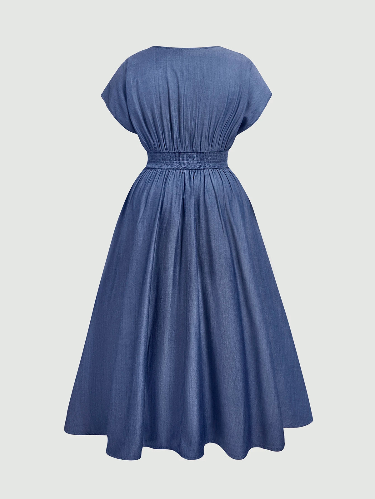 A blue A-line dress with short cap sleeves, a smocked waist, and a gathered back, shown from the back on a light gray background.