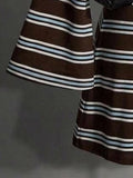 Close-up of flared sleeve and hem on brown striped knit mini dress