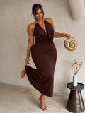 Front view of brown plus size halter maxi dress with gold collar and draped neckline