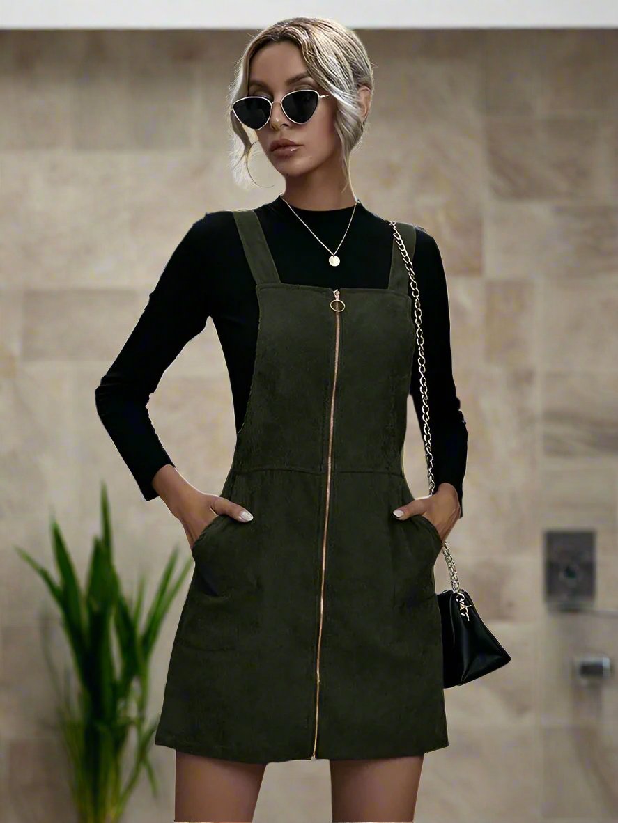 Stay on trend with our Chic and Stylish O-ring Zip-Up Corduroy Overall Dress. Featuring a modern O-ring zip-up closure and chic corduroy fabric, this dress is both fashionable and functional. Perfect for a stylish day out, this dress is a must-have for any fashion-forward individual.