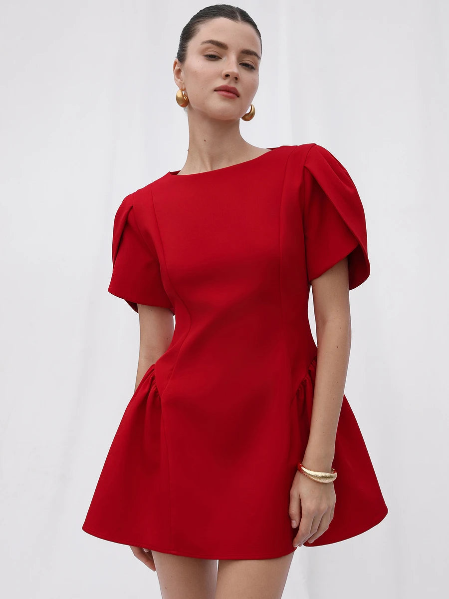 Close front view of red mini dress showing neckline, bodice seams and puff sleeves