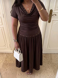 Close front view of dark brown short-sleeve midi dress with draped cowl neckline and ruched waist
